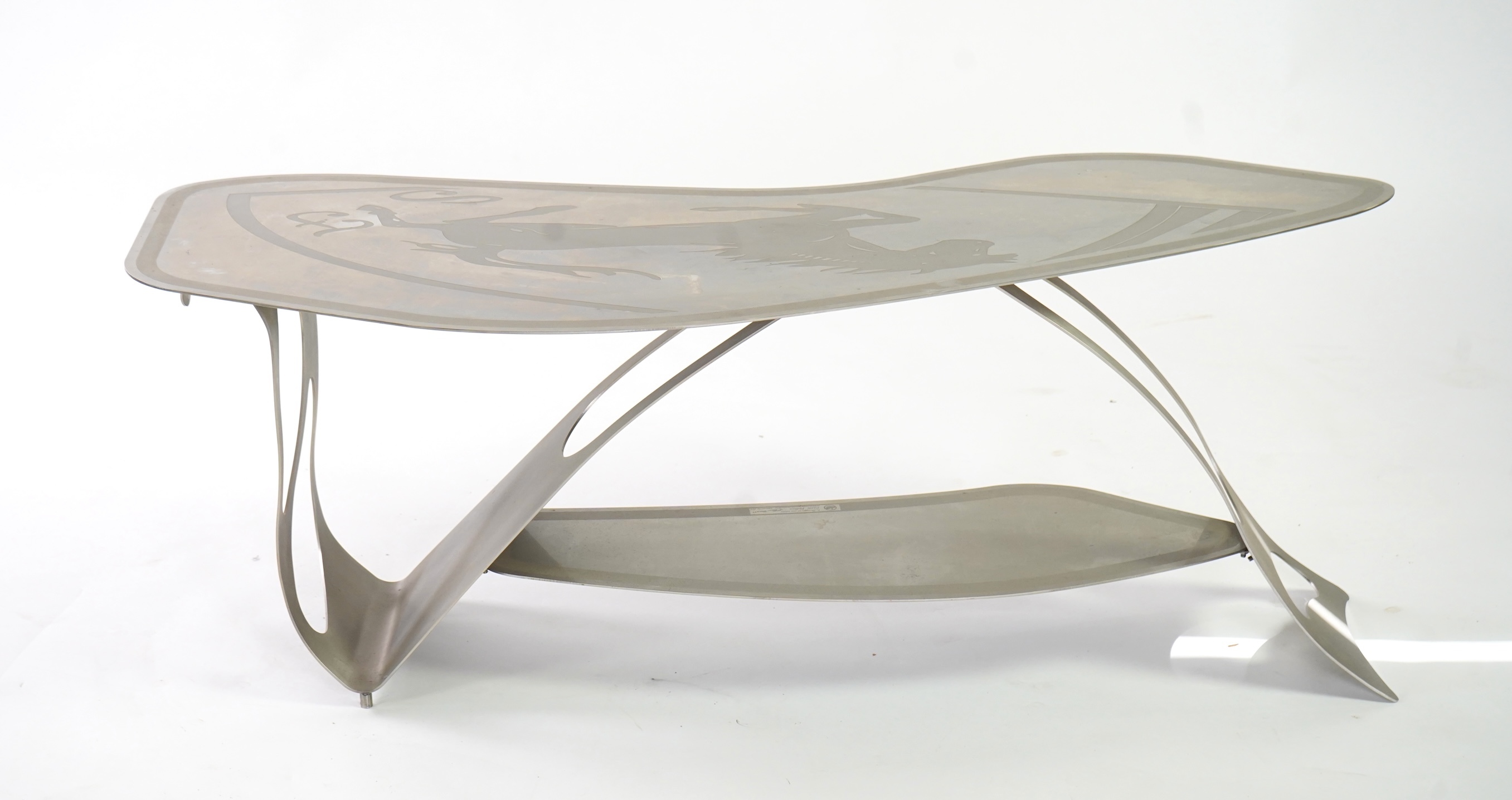 Pietro Psaier (Italian 1939-2004) A Ferrari polished steel coffee table, 1 of 3, in homage to Carlo Mollino